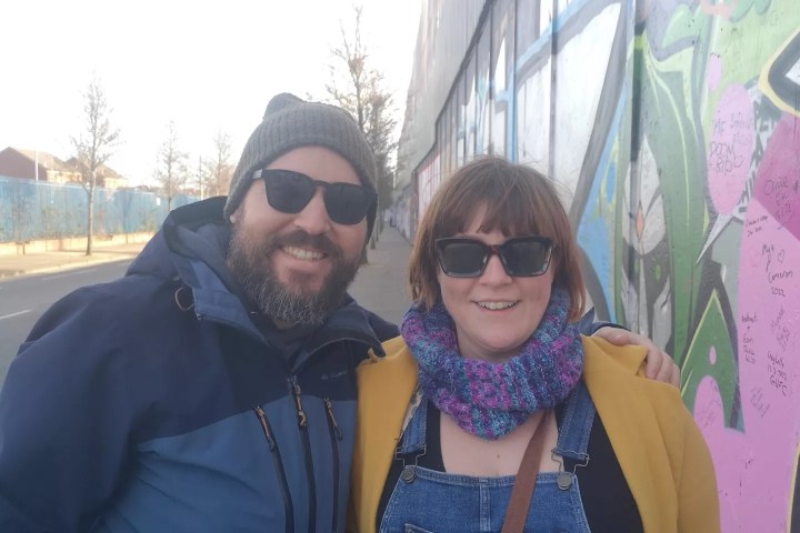 a person wearing sunglasses posing for the camera