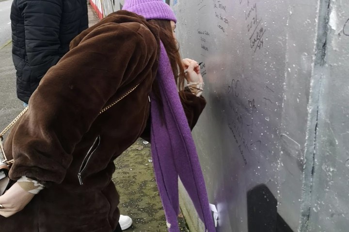 a woman holding a dog