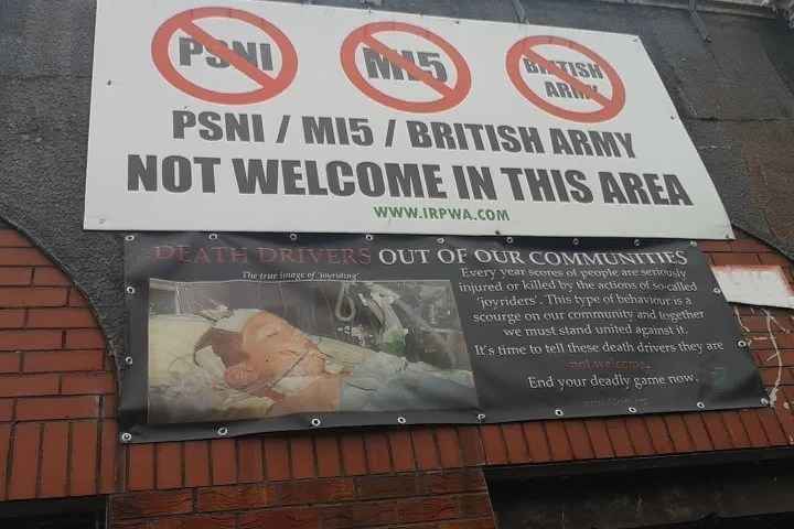 a sign above a storefront on a brick building