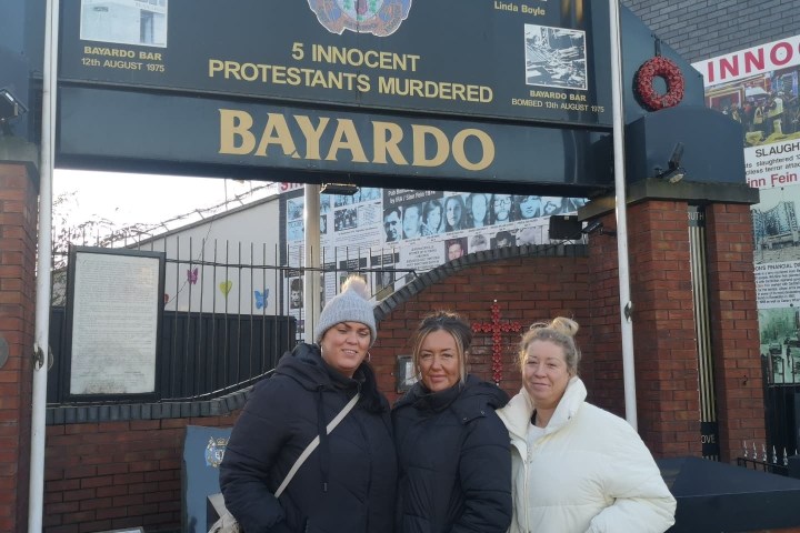 a group of people standing in front of a building