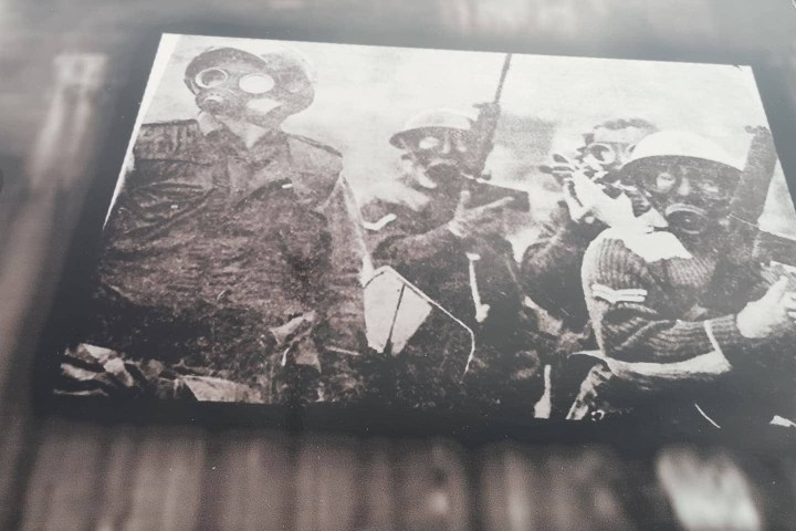 a group of people sitting on a bench