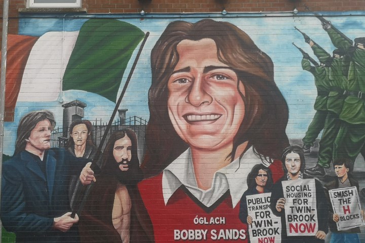 a man standing in front of a building