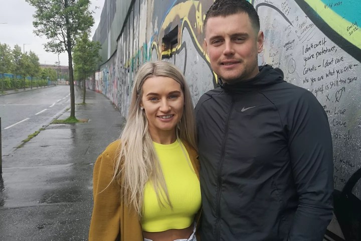 a person standing posing for the camera