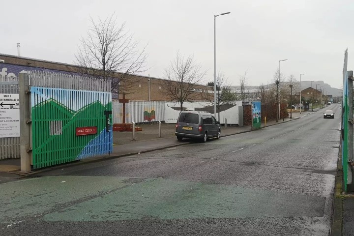 a train is parked on the side of a road