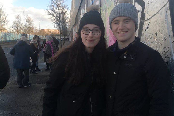 a man and woman posing for a photo