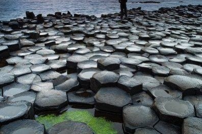a body of water with Giant's Causeway in the background